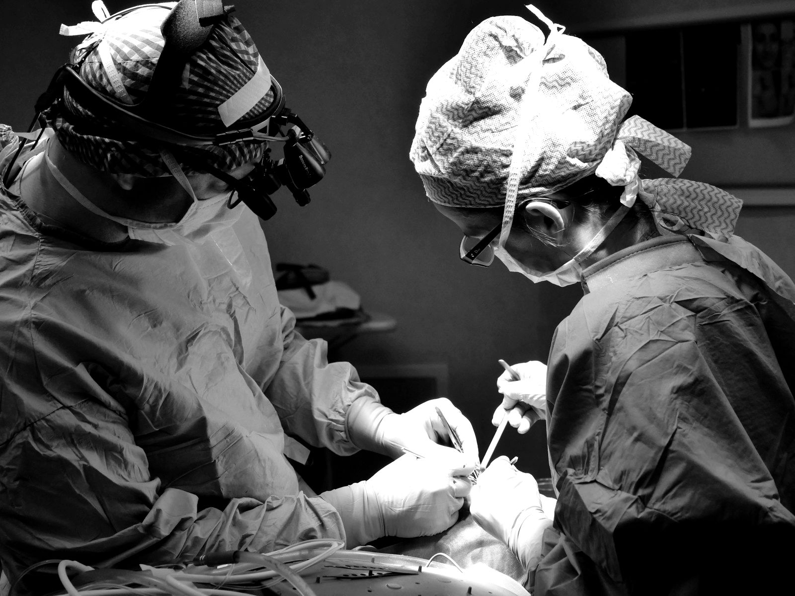 Surgeons operating under bright theatre lights